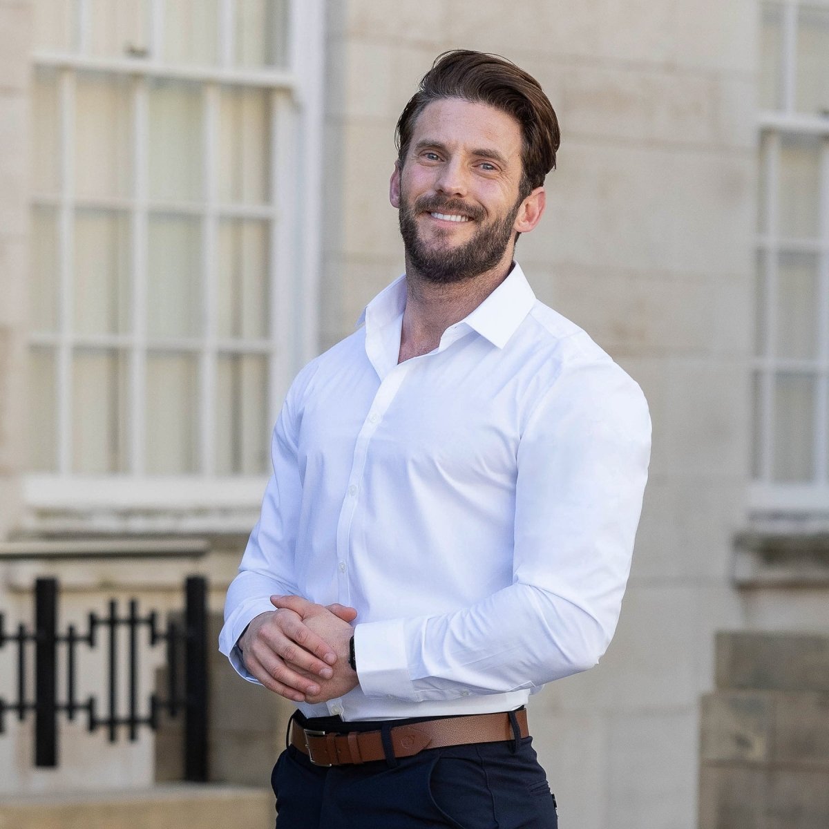 Man wearing white Muscle Fit dress shirt vs Slim Fit vs Athletic Fit Shirts  