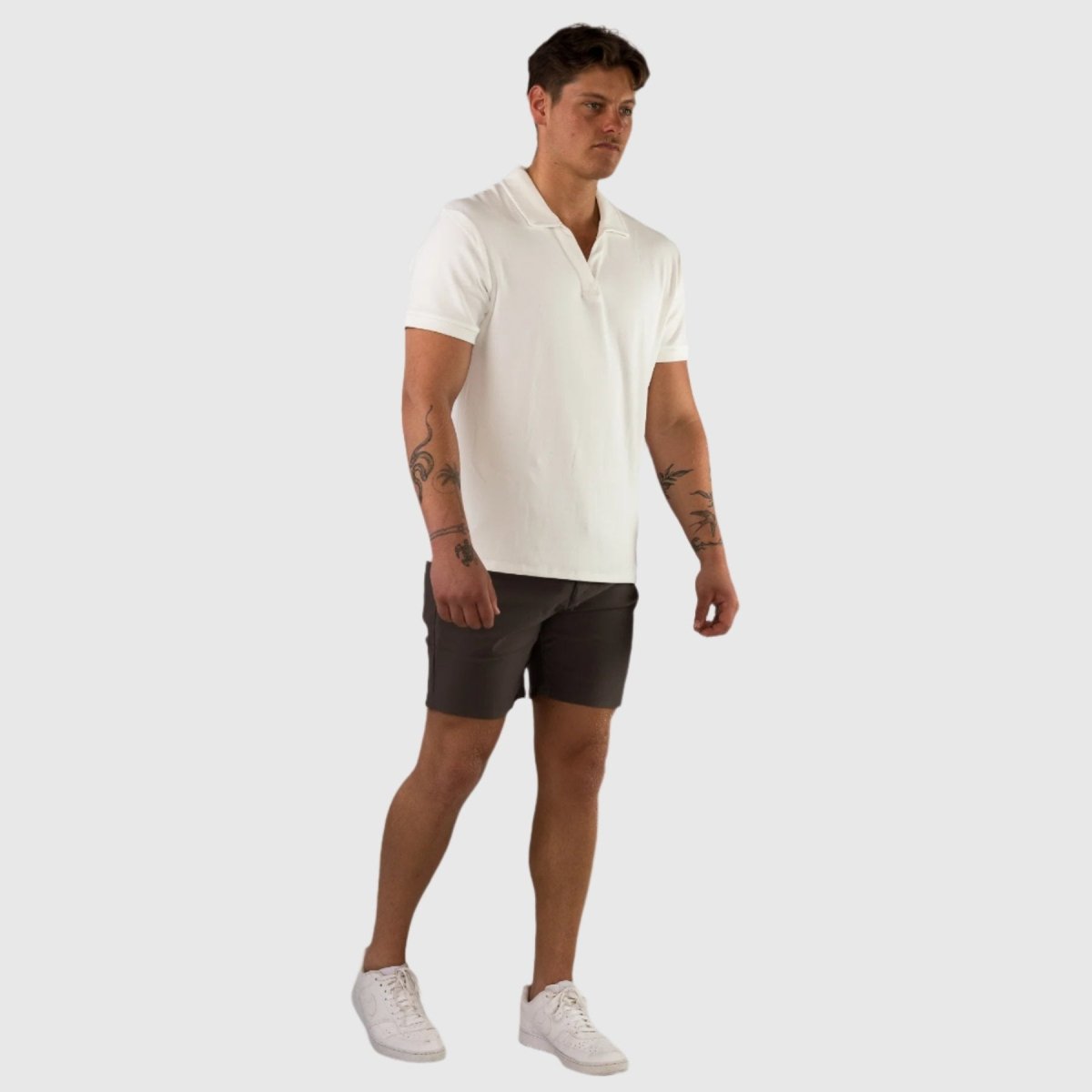 white open collar polo with chino shorts outfit ideas summer wedding 2025 